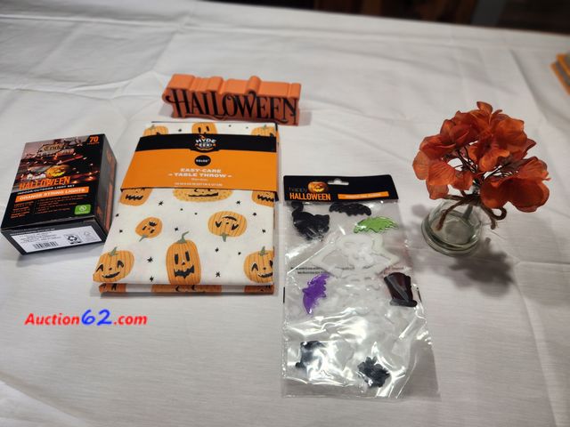 Lot 44-3610m - 1 new Hyde and Eek Easy care vinyl table throw. Measures 50 in x 50 in. 1 Happy Halloween Window Gel Clings. 1 approx 8 in long and 2 in hig...