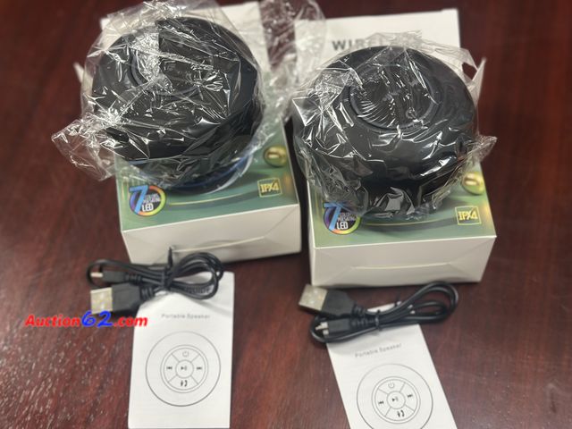 Lot 44-7542b - Lot of 2 blue tooth wireless speakers with built in suction cup. 7 color pulsating led lights. Compatible with phones and tablets. New. See ...