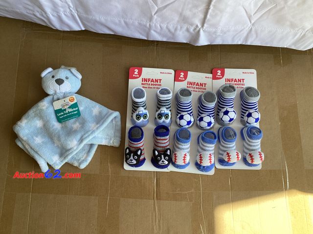 Lot 44-7728j - Lot of (3) 2 packs of infant rattle booties and (1) Lovie toy blanket.  Appears New, A basic inspection has been given to this item. Sold AS...