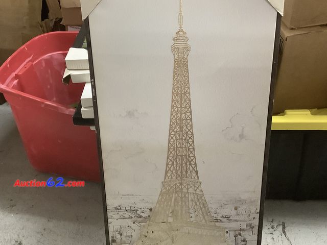 Lot 44-6185e - Gold-Tone Canvas wall art depicts a detailed illustration of the Eiffel Tower over a City Skyline. 18x35in Dust cover damaged on back. Appea...