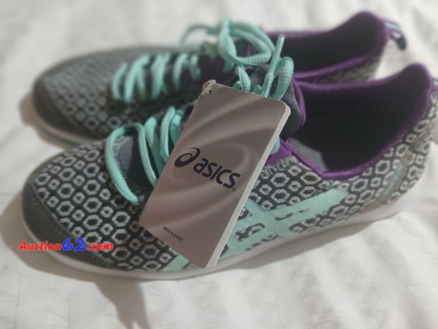 Lot 44-2010w - New with tag , no box Women's size 6.5 Asics tennis shoes, retail price 69.00.  See all photos.  Appears New, A basic inspection has been gi...
