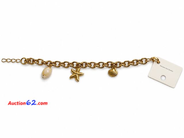 Lot 44-6005n - Women’s gold color ocean charm bracelet. Approximately 7 inches. Stamped s.steel. Appears New, A basic inspection has been given to this ite...