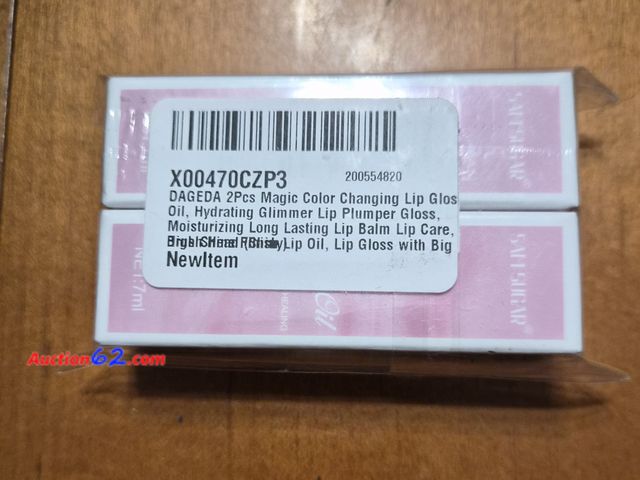 Lot 44-3004t - 2 Pack - DAGEDA Magic Color Changing Lip Gloss - See Pictures Appears New, A basic inspection has been given to this item. Sold AS-IS.