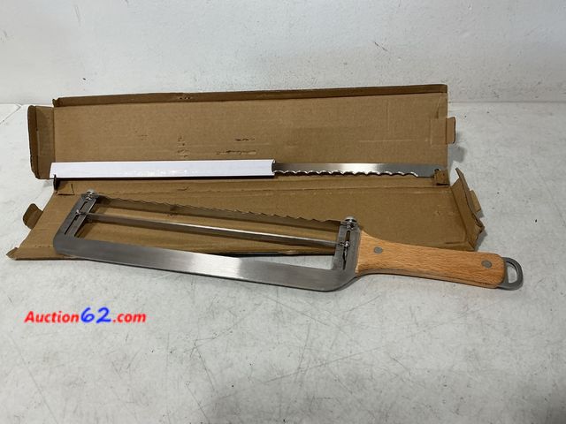 Lot 44-705 - Adjustable Cheese Slicer with Wooden Handle and Extra Wire See All Photo's Not Tested Appears New, A basic inspection has been given to this...