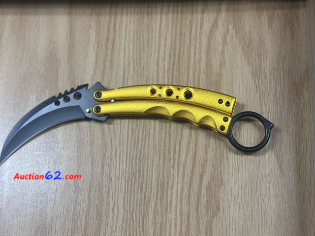 Lot 44-6124q - Gold color butterfly knife with belt clip. Very nice. New. Pre-priced $32 from store closing. Open for photos. See All Photo's Tested & Work...