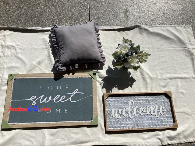 Lot 44-7868P - Lot of (2) grey/blue wall art, (1) throw pillow, (1) galvanized tin floral arrangement. Appears New, A basic inspection has been given to th...