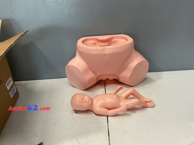 Lot 44-2981e - Medical Birthing Pelvis Model and Baby Doll with Baby Powder and Bulb Syringe Appears New, A basic inspection has been given to this item. S...