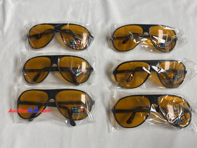 Lot 44-2122j - New. 6 pair black adult unisex Amber lens sunglasses. UV Amber Protection. Block Blue Light Lens. See photos. Appears New, A basic inspectio...
