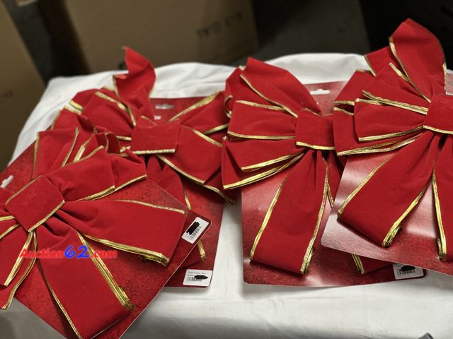 Lot 44-6118i - Box of Christmas bows and tree toppers. 17 pieces. Box measures 12x12x20 approximately. See All Photo's Appears New with box damage Never op...