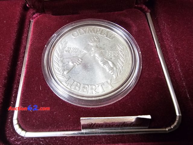 Lot 44-8333p - 1988-D OLYMPIC 90% SILVER DOLLAR COMMEMORATIVE. BRILLIANT UNCIRCULATED. MINTED IN DEVNER. IN ORIGINAL US MINT PACKAGING.-NT