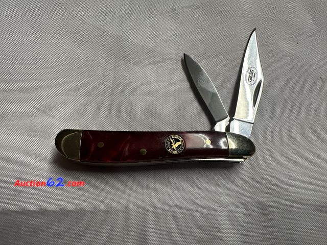 Lot 44-6100f - Eagle edge 2 blade peanut 440 s.steel about 3.75 in redish color handle. NEW. See All Photo's Not Tested Never opened, Factory Sealed