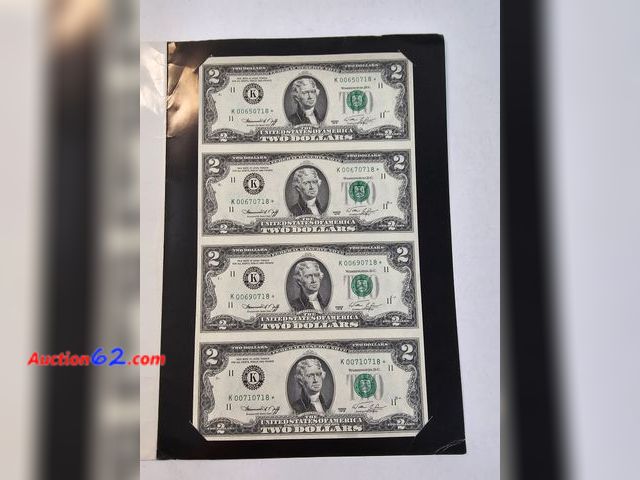 Lot 44-8338w - UNCUT SHEET OF FOUR 1976 $2 STAR NOTES WITH CONSECUTIVE LOW SERIAL NUMBERS! THEY COME IN A NICE PROTECTIVE FOLDER WITH INFORMATION ABOUT WHA...