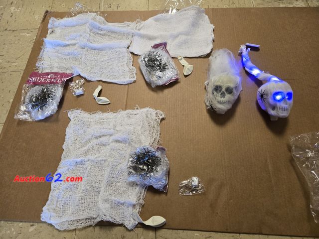 Lot 44-6696p - Leyndo 5 Pcs Halloween Decorations Include 3 Hanging Purple Light Spider Egg Sacks 2 Halloween Skull with Light up Eyes LED Hanging Skeleton...