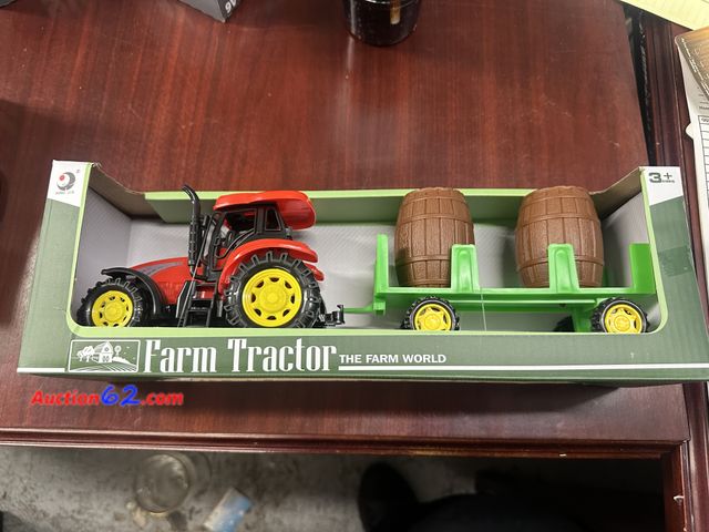 Lot 44-7506b - Toy farm tractor with trailer and barrels ages 3+. NEW. See All Photo's Not Tested Never opened, Factory Sealed