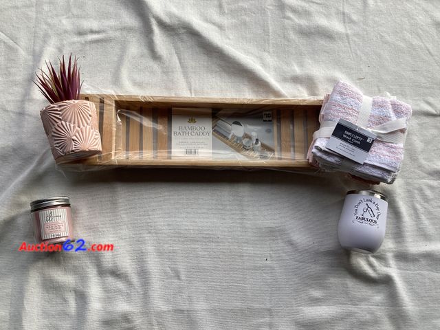 Lot 44-7889P - Lot of bathroom relaxation kit. (1) bamboo bath caddy, (1) insulated stemless wine glass, (1) wildflower gardenia candle, (1) 6 pack of   wa...