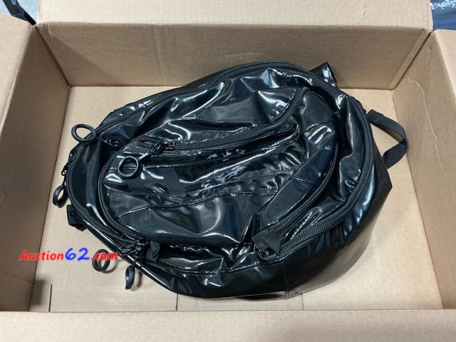 Lot 44-4104e - Black Shiny Convertible Backpack/Duffel Bag Appears New, A basic inspection has been given to this item. Sold AS-IS. Not Tested See All Phot...