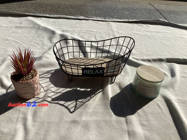 Lot 44-7876P - Lot of bathroom accessories. (1) faux succulent, (1) metal/wood “Relax” basket, (1) candle.  Appears New, A basic inspection has been given ...