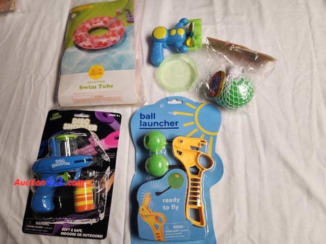 Lot 44-2345b - 1 LED Disc Shooter soft and safe indoors and out, 1 small bubble Blaster with bubble dish, 1 ball launcher ages 5+, 1 squishy ball, 1 swim b...