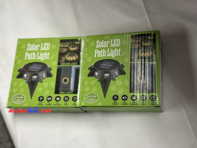 Lot 44-6100o - Set of 2 solar led path lights. New. Water resistant, easy installation, solar rechargeable, auto on/off long lasting. See All Photo's Not T...