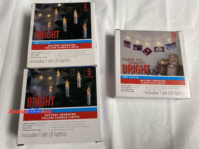 Lot 44-2002x - New in box. 2 sets of make the season Bright led indoor battery operated yellow candle lights. 1 set has 5 lights. Flickering yellow light. ...