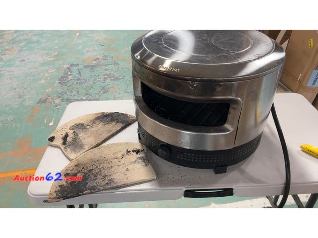 Lot 44-1976 - $250 Retail price - Solo Stove Pizza Oven with Pizza Stone (broken) Used See All Photo's Not Tested For parts or repair Dirty