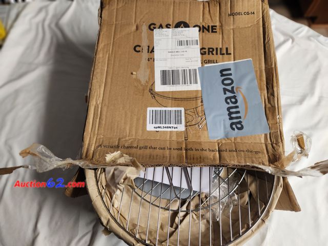 Lot 44-2334b - 1 14 in round in diameter charcoal grill by Gas One. Measures 37.5 x 14.5 x 39 cm. New in box. See photos. 1. Appears New, A basic inspectio...