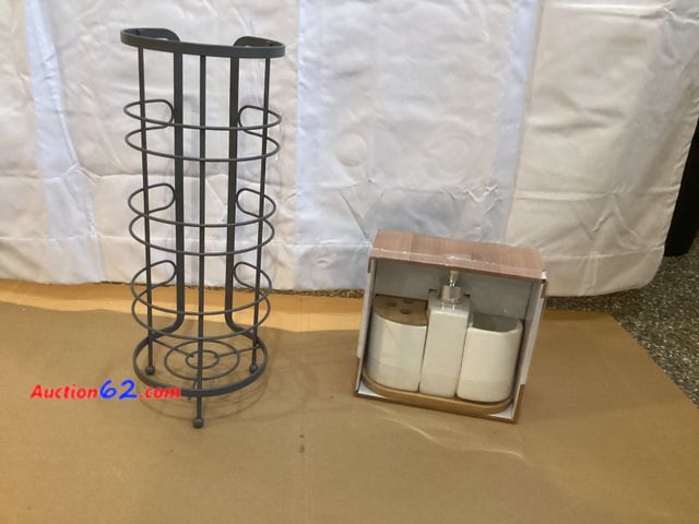 Lot 44-7703i - Lot of (1) toilet paper holder and (1) 4 piece bathroom set.  Appears New, A basic inspection has been given to this item. Sold AS-IS. See A...