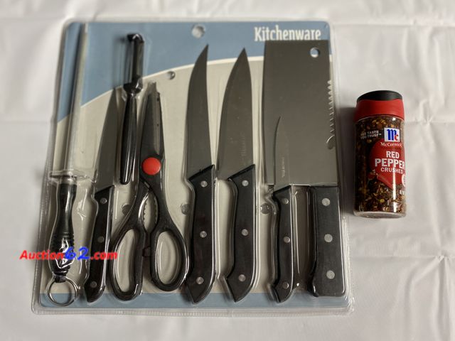 Lot 44-2156g - New. Kitchenware 8 pc set.  Set includes a cleaver, paring knife, 3 assorted knives, peeler, scissors, and a knife sharpener. Marked stainle...