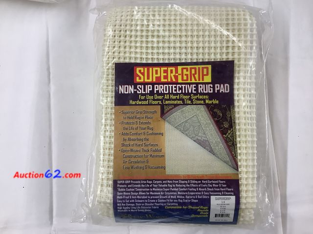 Lot 44-7515k - NEW. SUPER-GRIP non-slip protective rug pad. Will fit up to a 6x9 rug. See All Photo's Not Tested Never opened, Factory Sealed