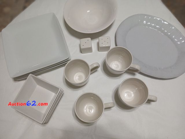 Lot 44-2116j - Six gently used white plates. One serving bowl.  One platter.  Four bowls.  Four coffee cups.  Salt and pepper shaker.  See photos. Used See...