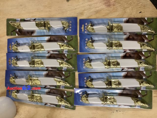 Lot 44-7503p - Lot of 10 toy knives with sheath looks to be sharp. New. See All Photo's Not Tested Unmarked, No barcodes