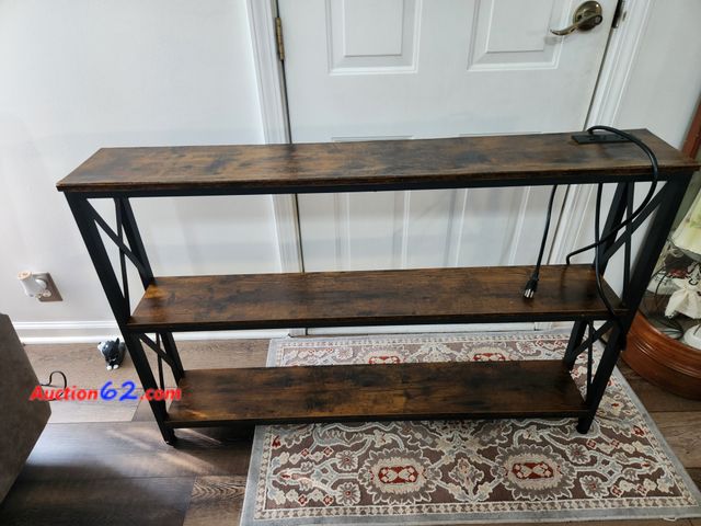 Lot 44-2110g - 1 3 shelf table. Has 2 plug ins on table and 2 phone charges.. Box had water damage. Pictures show the damage. New with damage. See photos. ...
