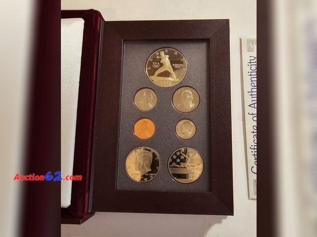 Lot 44-8308k - 1992 PRESTIGE SET WITH 90% PROOF SILVER OLYMPIC BASEBALL COMMEMORATIVE DOLLAR AND CLAD GYMNAST HALF DOLLAR. IN ORIGINAL US MINT GOVERNMENT P...