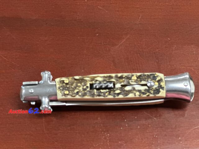 Lot 44-6207w - Stiletto style knife. Push button and slide lock. Nylon belt carrying case. Bone style handles. New.#71222. See All Photo's Tested & Working...