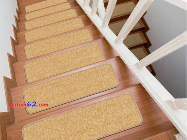 Lot 44-748b - Retail value $50- Solid Beige 26 in. x 8.5 in. Non-Slip Rubber Back Stair Tread Cover (Set of 15) 1. Appears New, A basic inspection has bee...