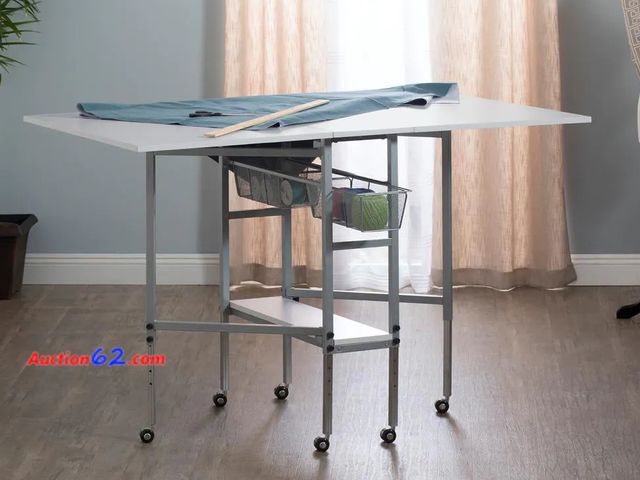 Lot 44-97g - Retail value of $202- Sew Ready Hobby Craft 60 in. W x 36 in. D MDF Folding Fabric Cutting Table with Drawers, Adjustable Height, Silver / W...