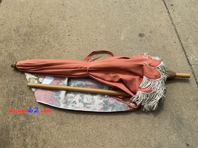 Lot 44-313e - $150 Retail price - Terracotta Patio Umbrella with Fringe and Floral Lining See All Photo's E-Commerce Return, A basic inspection has been g...
