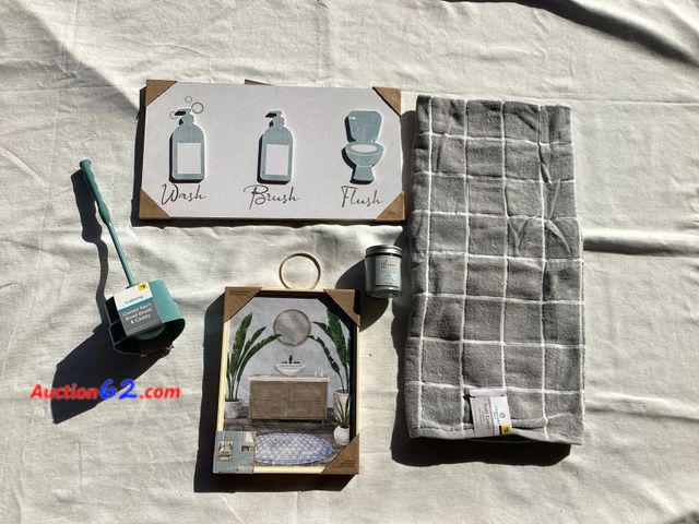 Lot 44-7873P - Lot of bathroom accessories and decor. (1) corner toilet brush caddy, (1) candle, (1) grey bath towel, (2) wall art.  Appears New, A basic i...