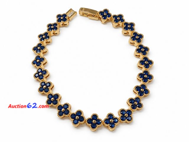 Lot 44-6001n - Women’s gold color bracelet with dark blue stones. Approximately 7in. No markings. Appears New, A basic inspection has been given to this it...