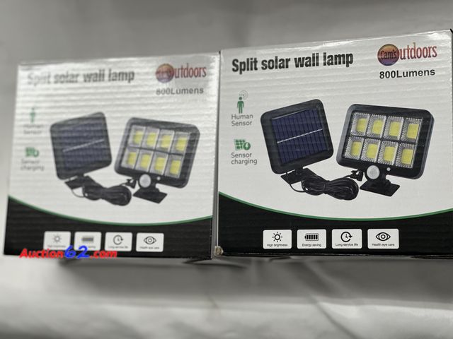 Lot 44-6024o - Set of two split solar wall lamps 800 lumens each. Both come with solar panels and lights. New. See All Photo's Not Tested Never opened, Fac...