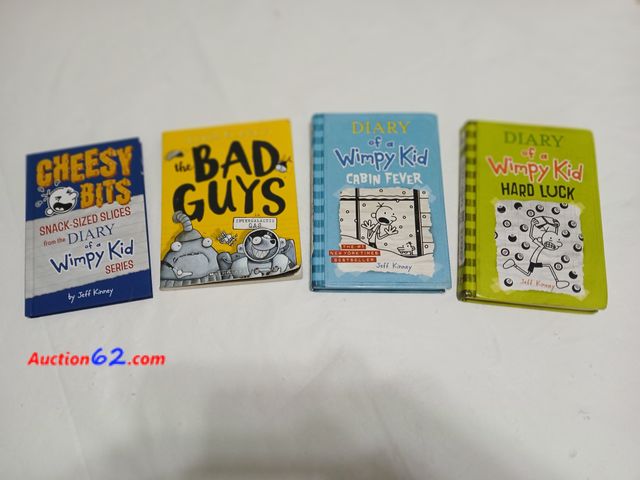 Lot 44-2020w - One new book, Cheesy Bits Snack- Sized Slices from the Diary of a Wimpy Kid series.  One gently used Dairy of a Wimpy Kid, Cabin Fever.  Dai...