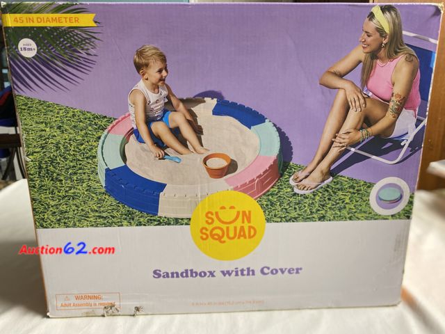 Lot 44-2007w - New in box. Sun Squad sandbox with cover. 6”H X 45” diameter. Ages 18 months +. Requires 150 lbs. sand not included. See photos. Appears New...