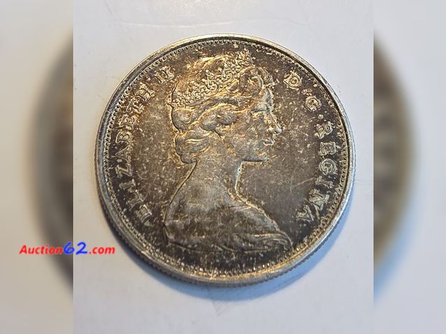 Lot 44-8345k - 1965 **80% SILVER** CANADA HALF DOLLAR. OVER A THIRD OF AN OUNCE OF SILVER!! PORTRAIT OF QUEEN ELIZABETH II ON THE OBVERSE!! COMES IN A PROT...