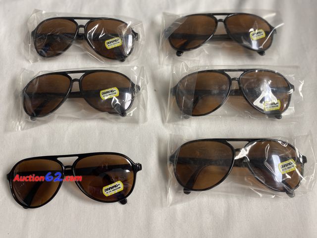 Lot 44-2020i - New. 6 pairs unisex sunglasses. Black frames. Driving UV Eye Protection. See photos. Appears New, A basic inspection has been given to this ...