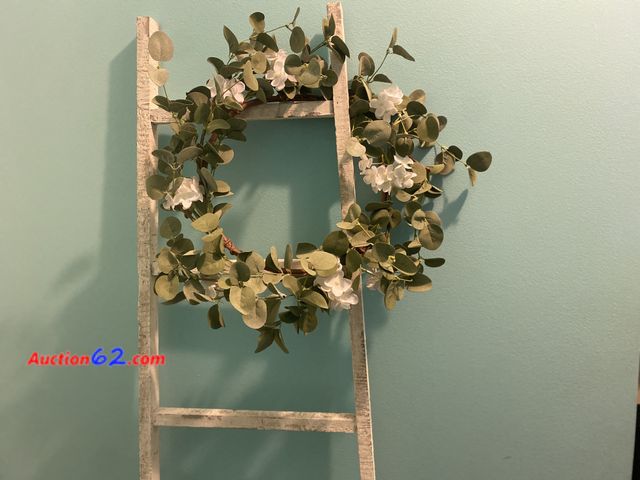 Lot 44-2151g - New without tags. Distressed white 66” decorative ladder and 16” wreath. See photos. Appears New, A basic inspection has been given to this ...