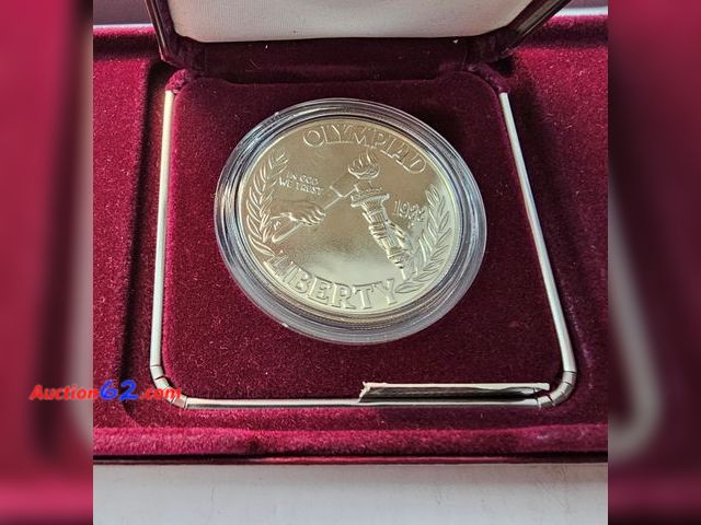 Lot 44-8319q - 1988 OLYMPIC 90% SILVER DOLLAR. BRILLIANT UNCIRCULATED. MINTED IN DENVER. COMES IN ORIGINAL U.S. MINT PAKAGING W/COA.  SILVER IS NOW OVER $5...