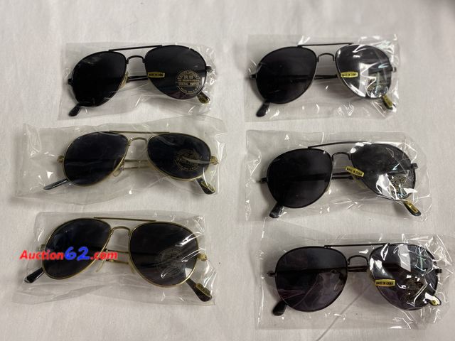 Lot 44-2007i - New. Appears to be women’s or older child’s sunglasses. 4 pairs black metal framed with dark lens. 2 pr gold color metal frames with dark le...