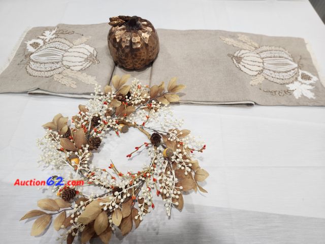 Lot 44-3601m - 1 approx 7 ft long x 1 ft wide pumpkin embroidered table runner. Burlap color with light cream and tan pumpkins on end. 1 tan leaf, pinecone...