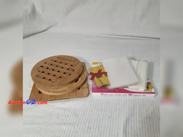 Lot 44-5306g - Lot of (2) kitchen items. 3-piece set bamboo trivets/hotpads. 300 pieces cake pop sticks and wrappers kit to make 100 cake pops or lollipops...