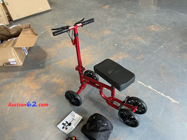 Lot 44-4048f - Red Steerable Knee Walker Scooter with Bag and Manual See All Photo's Not Tested E-Commerce Return, A basic inspection has been given to thi...
